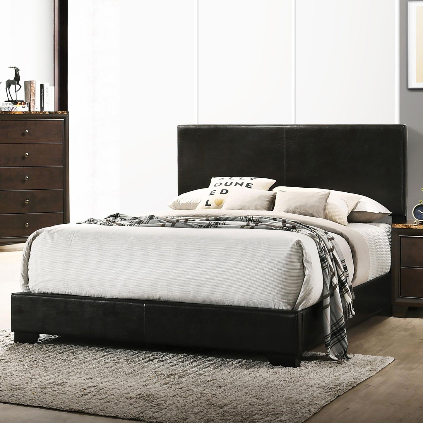 Jaxson Black Faux Leather Queen Panel Bed